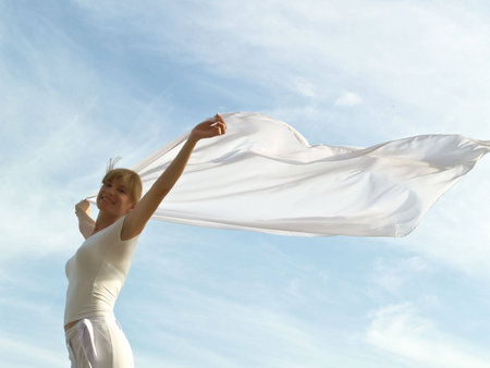 Session of a relaxation on a background of the years sky of the girl in whiteの写真素材