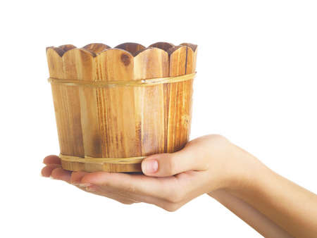 Single wooden sauna vat with water against the white backgroundの写真素材