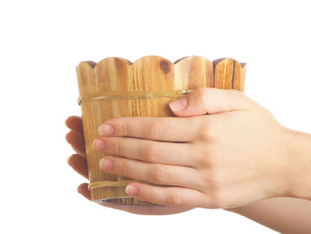 Single wooden sauna vat with water against the white backgroundの写真素材