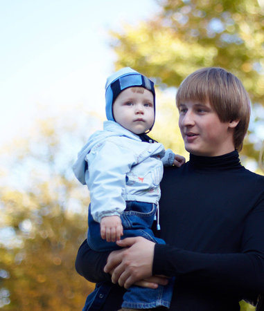 The daddy with the small son on walk