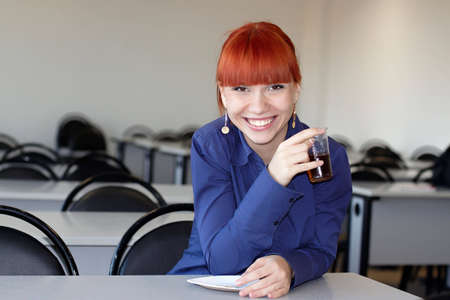 The student drinks tea in a class roomの写真素材