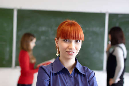 Employment at students in the higher school near a blackboardの写真素材