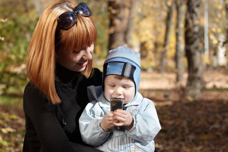 Baby boy with mother play in park