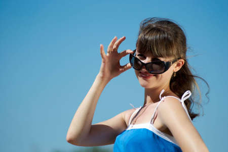 Portrait of beautiful laughing woman with sunglasses の写真素材