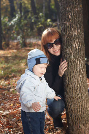 Baby boy with mother play in parkの写真素材