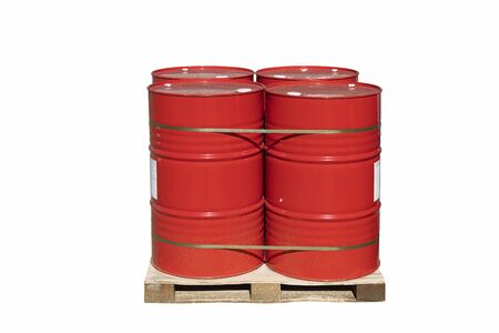 Four red barrels of 200 liters for liquid. Barrels stand on a pallet. Hazardous liquid in steel barrels. Isolated white background.の写真素材