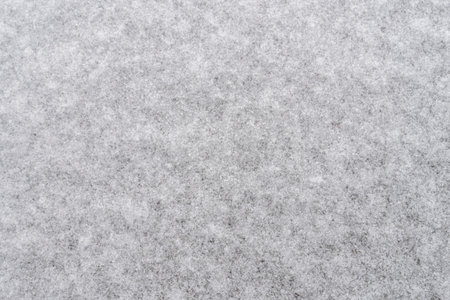 White snow background for designers. White snow closeup snowflakes. Crystals of snow on the ground, winter came cold.の写真素材