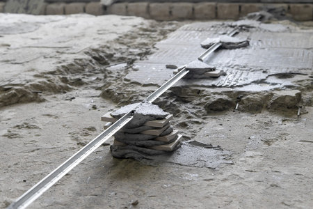 Floor repair, installation of guides for concrete screeds. Installation of a level for pouring...