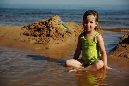 Child playing at the beachの写真素材