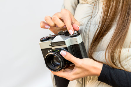 the girl with the French manicure is holding the cameraの写真素材