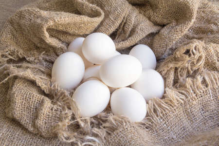 close-up white eggs on a Brown canvasの写真素材