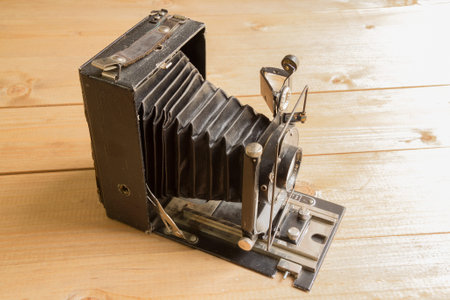 Vintage camera on the Brown wooden background