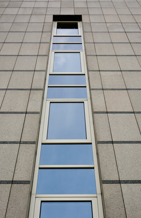 Facade of modern office building with reflections