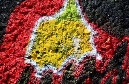 Old grunge stone wall with colorful graffitiのeditorial素材