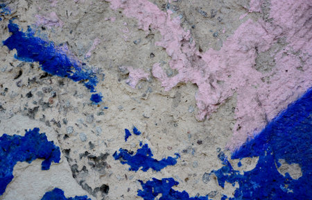 Old grunge stone wall with colorful graffitiの写真素材