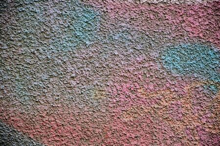 Colorfully painted stone wall as backgroundの写真素材