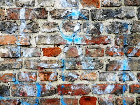 Grunge  brick wall with old paintのeditorial素材