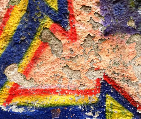Old grunge wall with colorful graffitiの写真素材