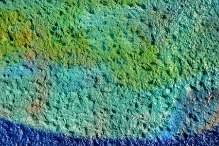 Colorfully painted stone wall as backgroundの写真素材