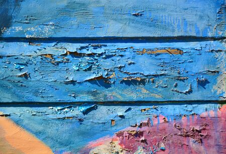 Old peeling paint on grunge wooden surfaceの写真素材