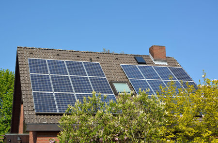 Ecological and renewable solar energy panels on the roof of a house