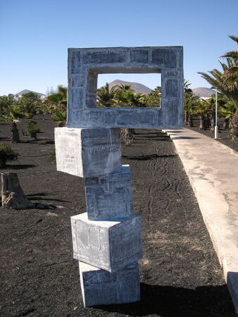 Concrete sculpture on a backgrounds of mountainsの写真素材