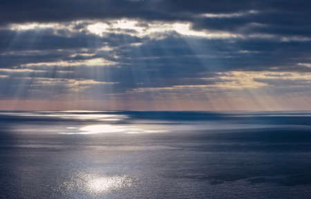 Rays of a sun above a seaの写真素材