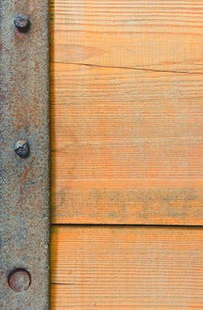 Texture of wooden board with a steel stripeの写真素材