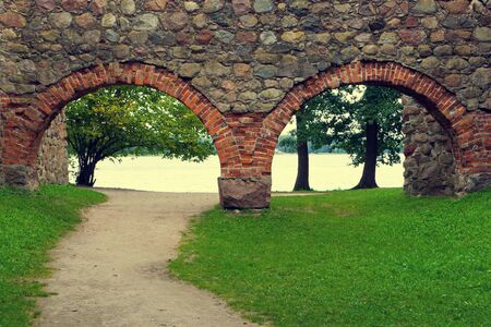 Walkway in the old castle, leading to the lakeの写真素材