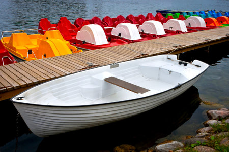 White boat and excursion catamarans on moorage