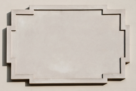 Vintage plate on concrete wallの写真素材