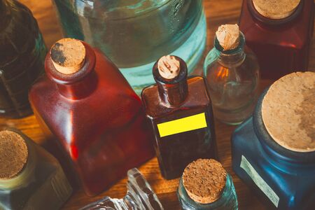 Coloured glass pharm bottles with corks.Kind from aboveの写真素材