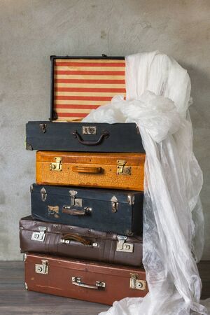Old suitcase with white clothの写真素材