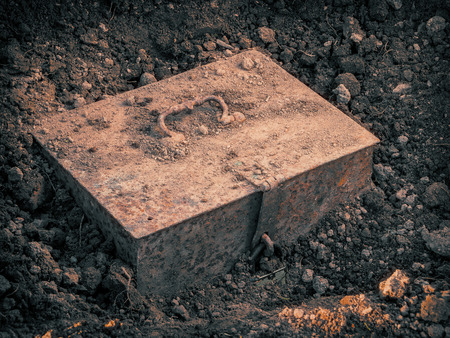 Old metal chest with the treasure found in the groundの写真素材