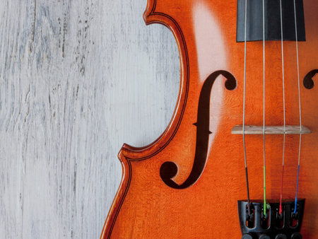 Violin close-up shot on an old table the painted