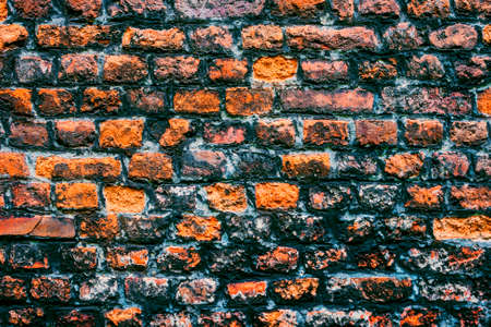 A fragment of the old brick wall is taken off in the open air in the old townの写真素材