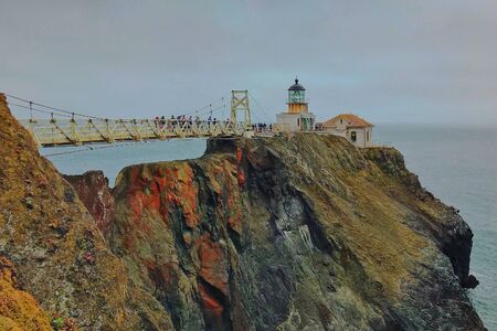 Old lighthouse stands on the edge of a cliff in California, USAの写真素材