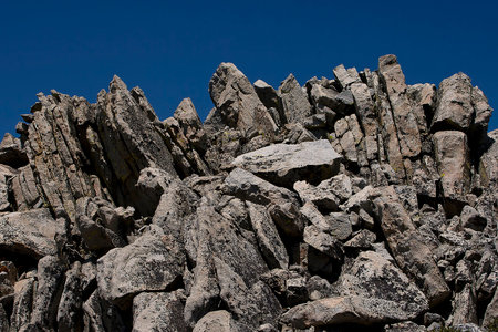 Sharp rocks on the West coast of California, USA are taken on a Sunny summer day against a blue sky