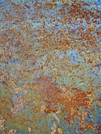 The texture of a rusty metal sheet is taken in close-up