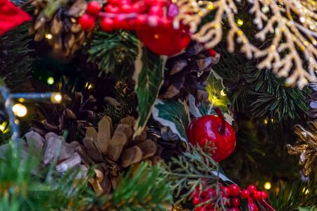 Christmas decorations. Collage of Christmas toys, spruce branches, cones and berries. Close-up.の写真素材