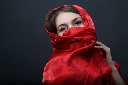 Girl with red shawlの写真素材