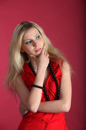 Girl in a red. Studio shotの写真素材