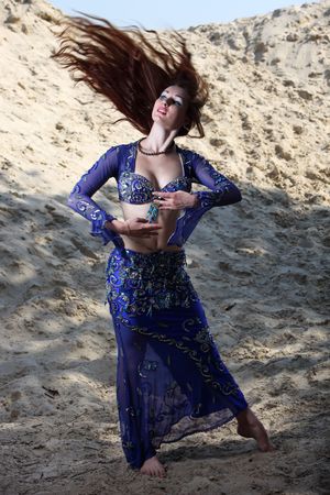 Belly dancer on the sandの写真素材