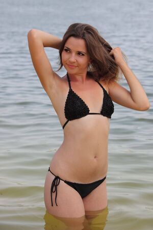 Attractive young woman swim in the riverの写真素材
