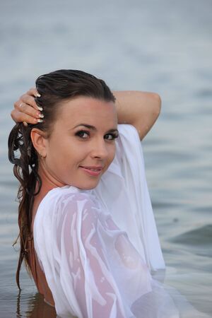 Attractive young woman swim in the riverの写真素材