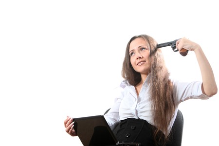 Businesswoman with a notebook want shoot oneself by revolverの写真素材