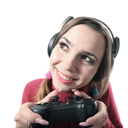 Funny girl with gamepad play computer game and smile