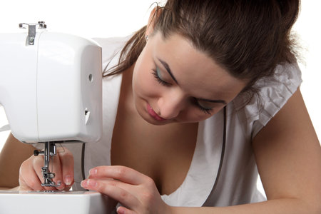 Woman seamstress work on the sewing-machine