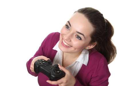 Young women play wideogame by gamepad on the white isolated background