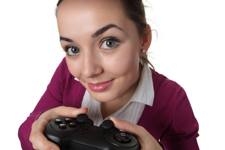 Young women play wideogame by gamepad on the white isolated background